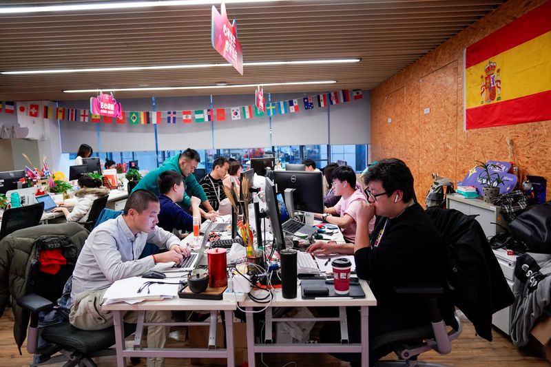 Employees work at AliExpress office at the Alibaba company's headquarters in Hangzhou, Zhejiang province, China, November 18, 2019. REUTERS/Aly Song
