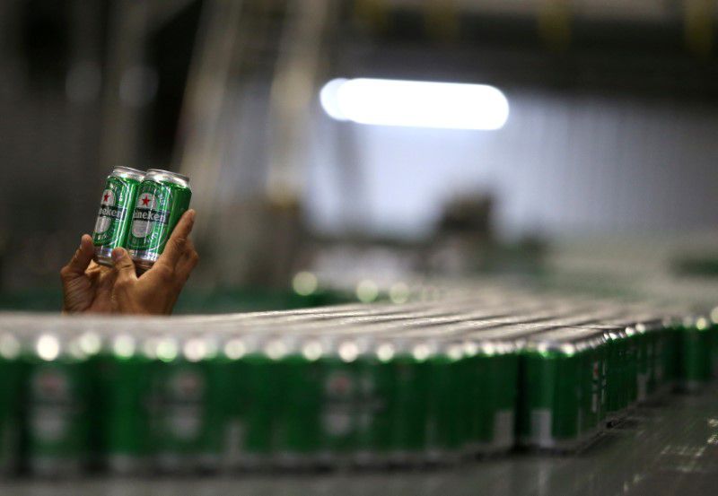 FILE PHOTO: An employee checks Heineken beers at the Heineken brewery in Jacarei, Brazil June 12, 2018. REUTERS/Paulo Whitaker/File Photo