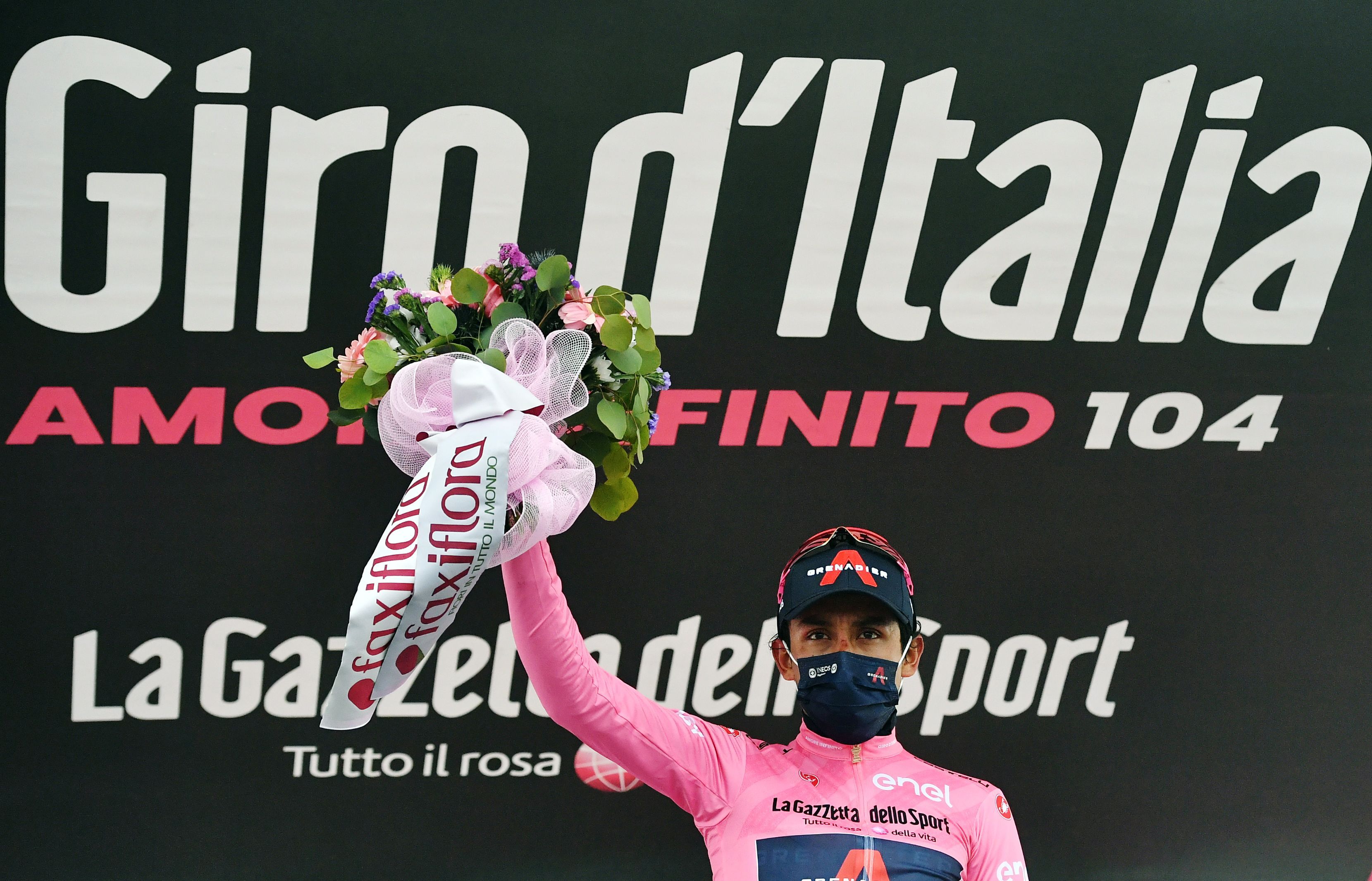 Cycling - Giro d'Italia - Stage 14 - Cittadella to Monte Zoncolan, Italy - May 22, 2021 Ineos Grenadiers rider Egan Arley Bernal Gomez of Colombia celebrates wearing the maglia rosa on the podium after stage 14 REUTERS/Jennifer Lorenzini
