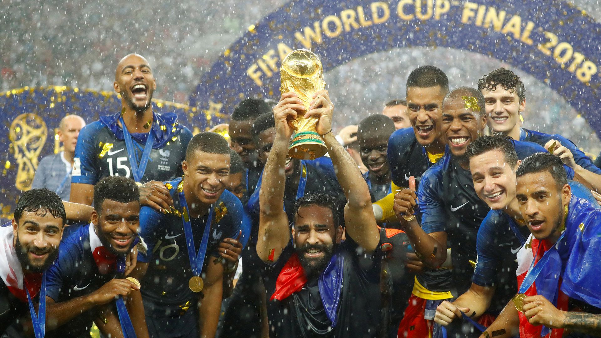 Soccer Football - World Cup - Final - France v Croatia - Luzhniki Stadium, Moscow, Russia - July 15, 2018 France's Adil Rami and team mates celebrate with the trophy after winning the World Cup REUTERS/Kai Pfaffenbach