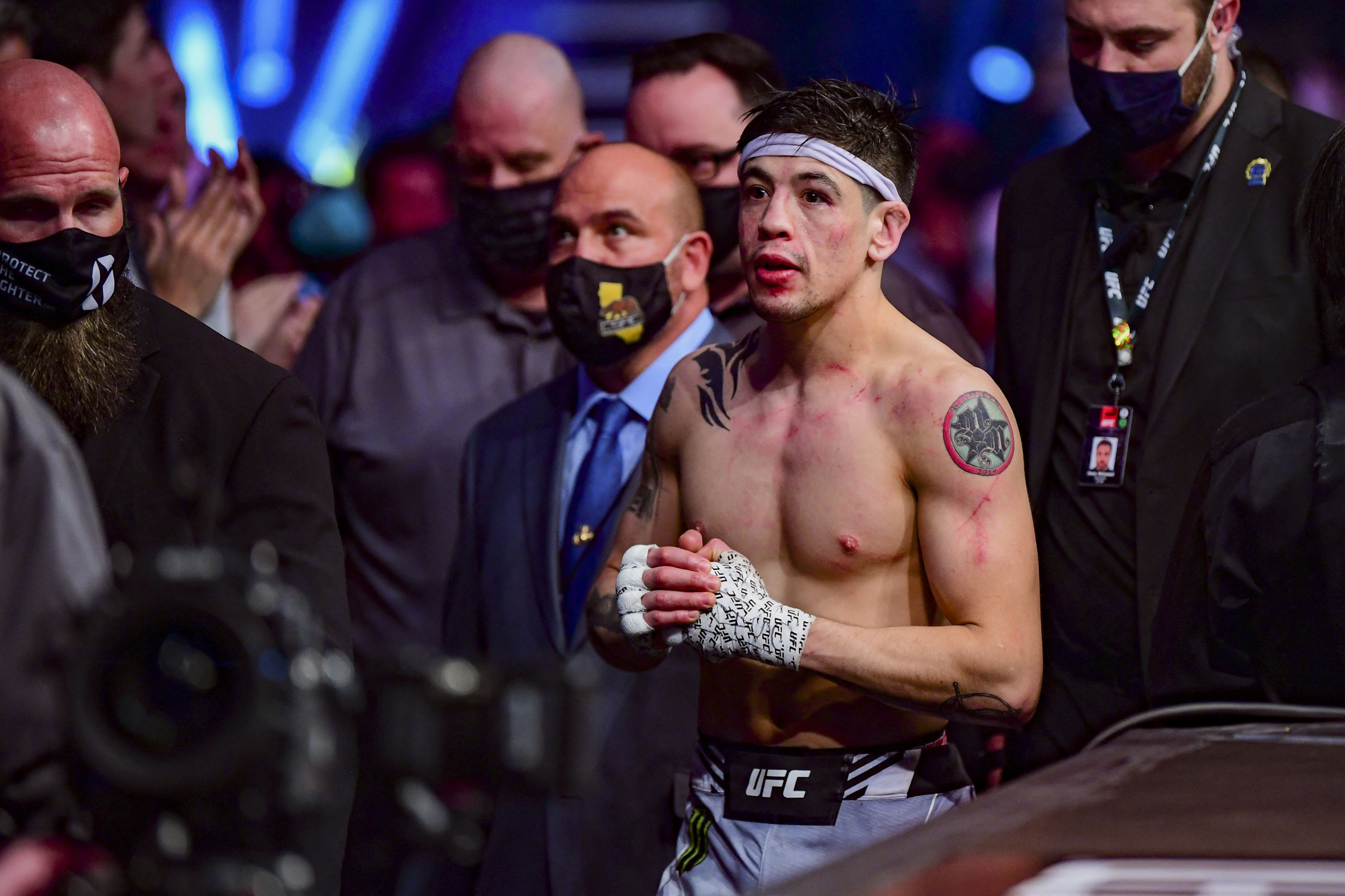 Jan 22, 2022; Anaheim, California, USA; Brandon Moreno leave the octagon after his loss against Deiveson Figueiredo during UFC 270 at Honda Center. Mandatory Credit: Gary A. Vasquez-USA TODAY Sports