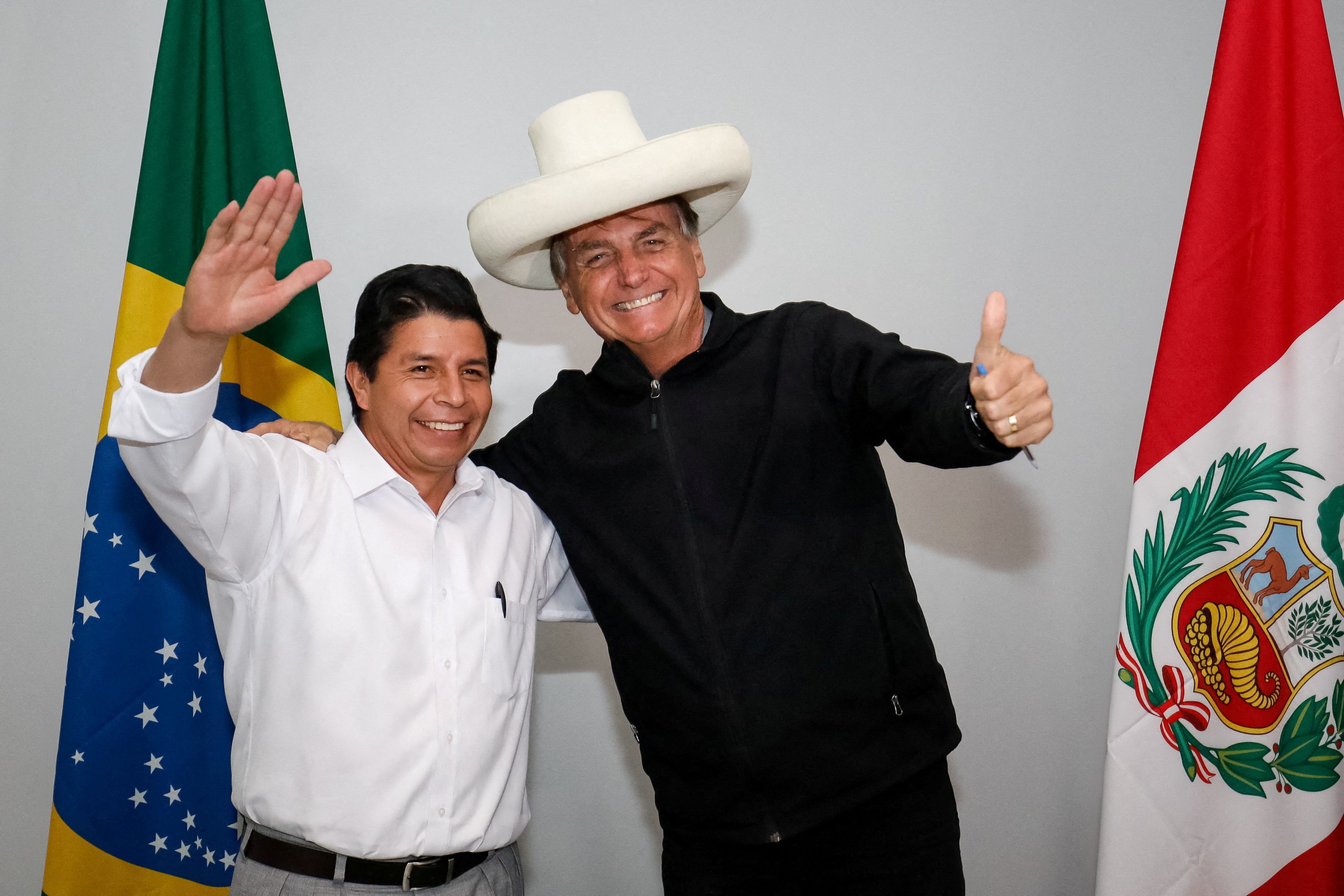 FILE PHOTO: Brazil's President Jair Bolsonaro and his Peruvian counterpart Pedro Castillo wave as they pose for a picture in Porto Velho, Rondonia state, Brazil, February 3, 2022. Alan Santos/Brazilian Presidency/Handout via REUTERS THIS IMAGE HAS BEEN SUPPLIED BY A THIRD PARTY. MANDATORY CREDIT/File Photo