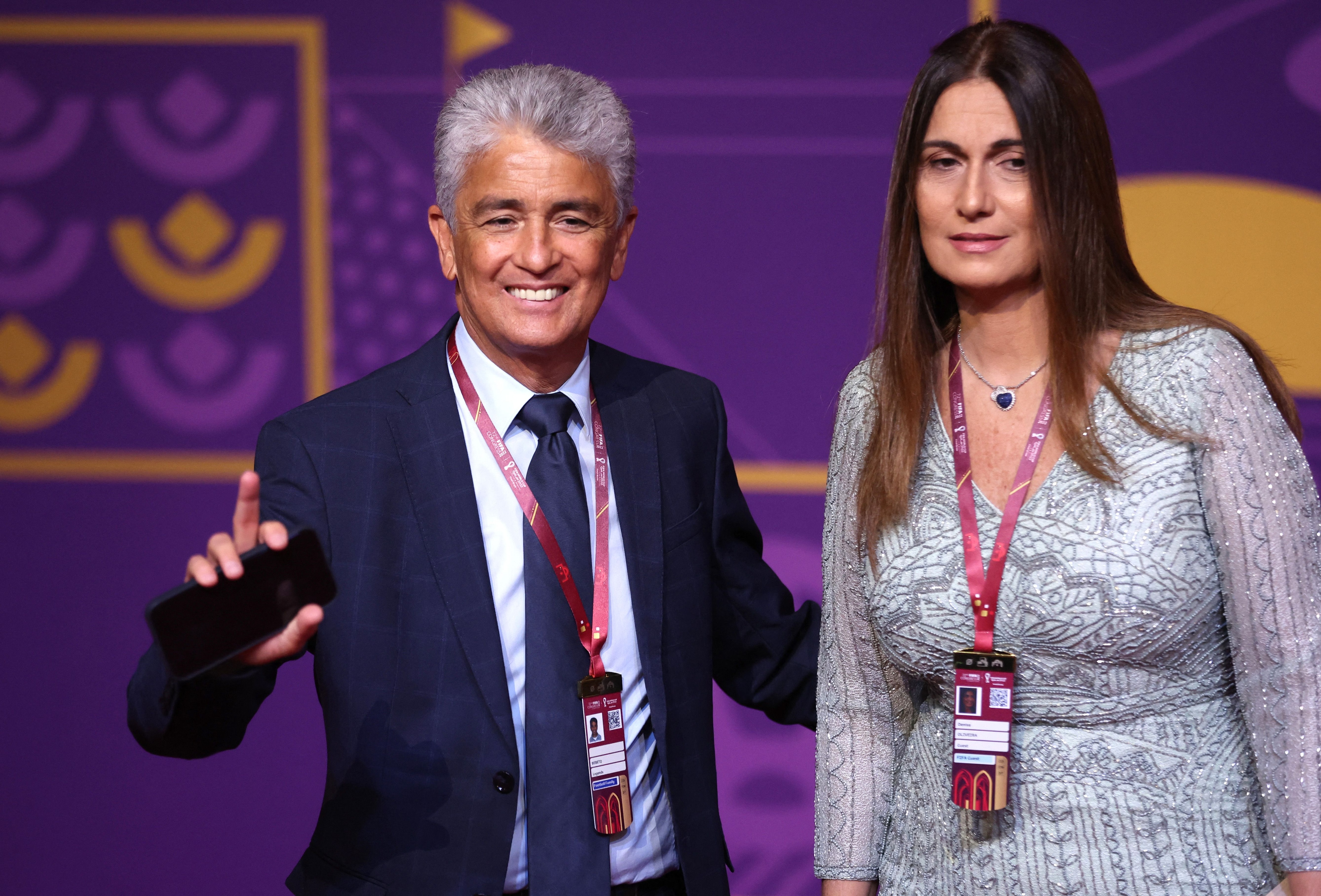 Soccer Football - World Cup - Final Draw - Doha Exhibition & Convention Center, Doha, Qatar - April 1, 2022 Former player Bebeto and his wife Denise de Oliveira arrive ahead of the draw REUTERS/Carl Recine