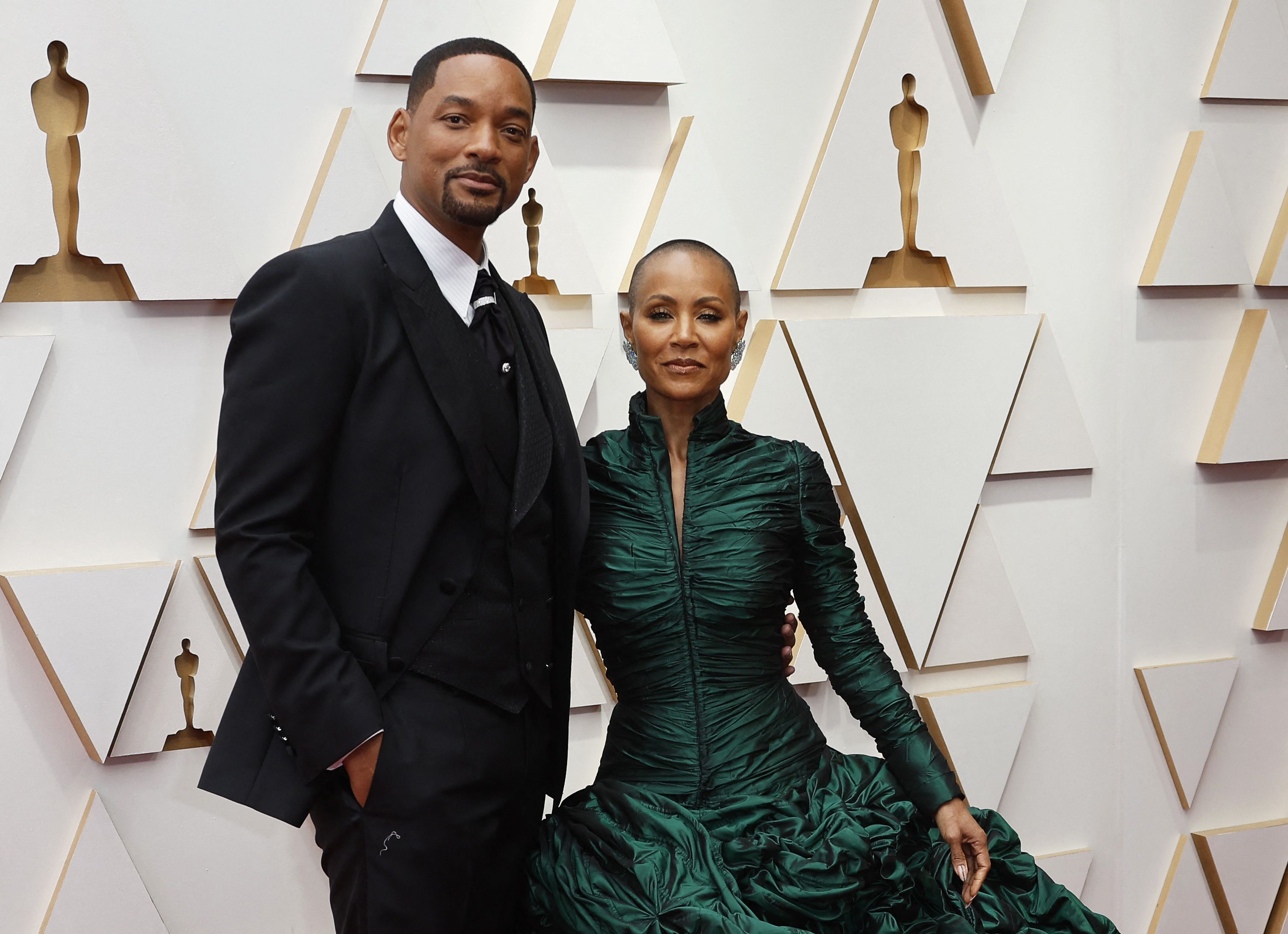 Will Smith and Jada Pinkett Smith pose on the red carpet during the Oscars arrivals at the 94th Academy Awards in Hollywood, Los Angeles, California, U.S., March 27, 2022. REUTERS/Eric Gaillard
