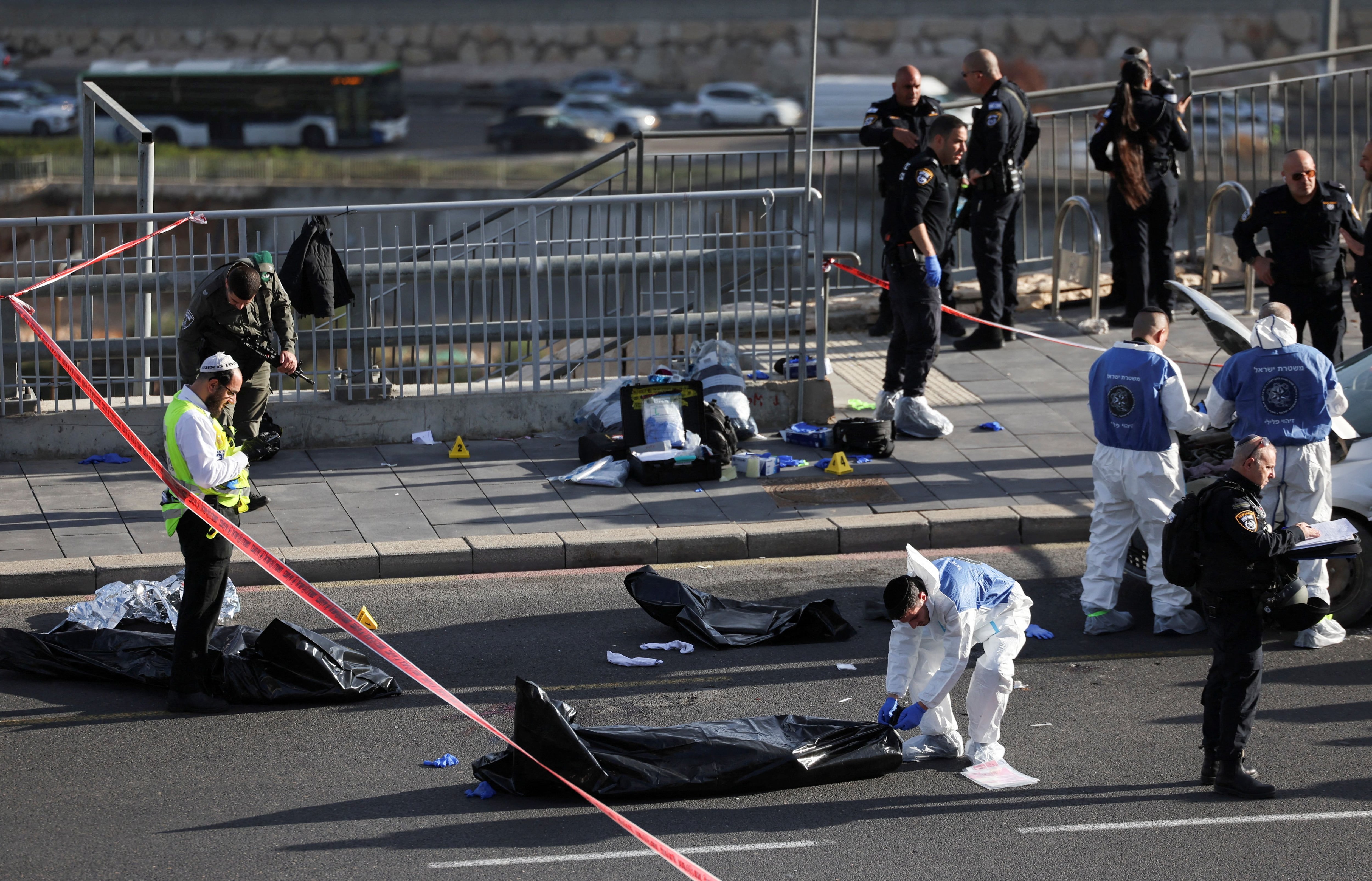 Israeli officials work at the scene of a violent incident in Jerusalem November 30, 2023 REUTERS/Ronen Zvulun