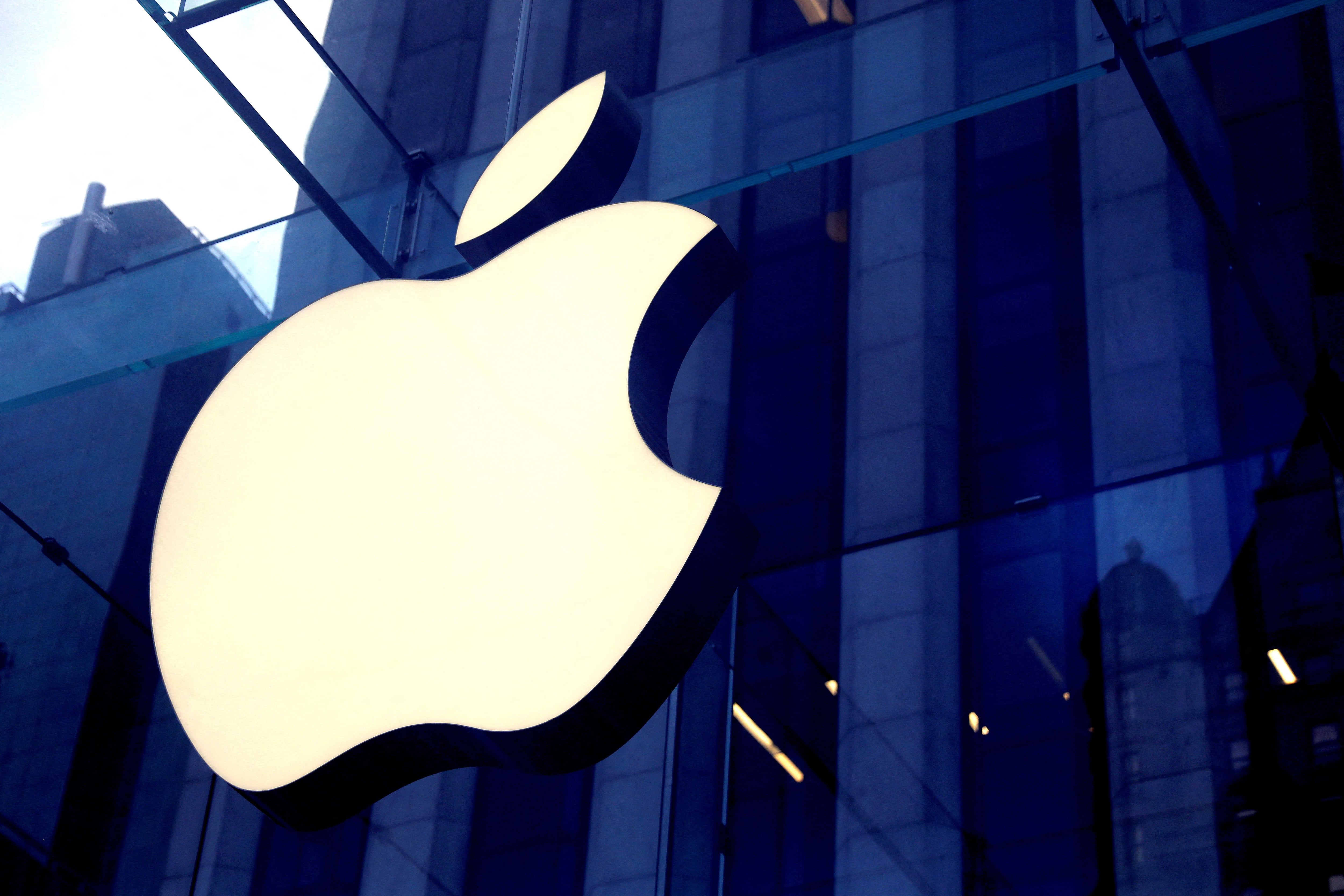 FILE PHOTO: The Apple Inc logo is seen hanging at the entrance to the Apple store on 5th Avenue in Manhattan, New York, U.S., October 16, 2019. REUTERS/Mike Segar/File Photo
