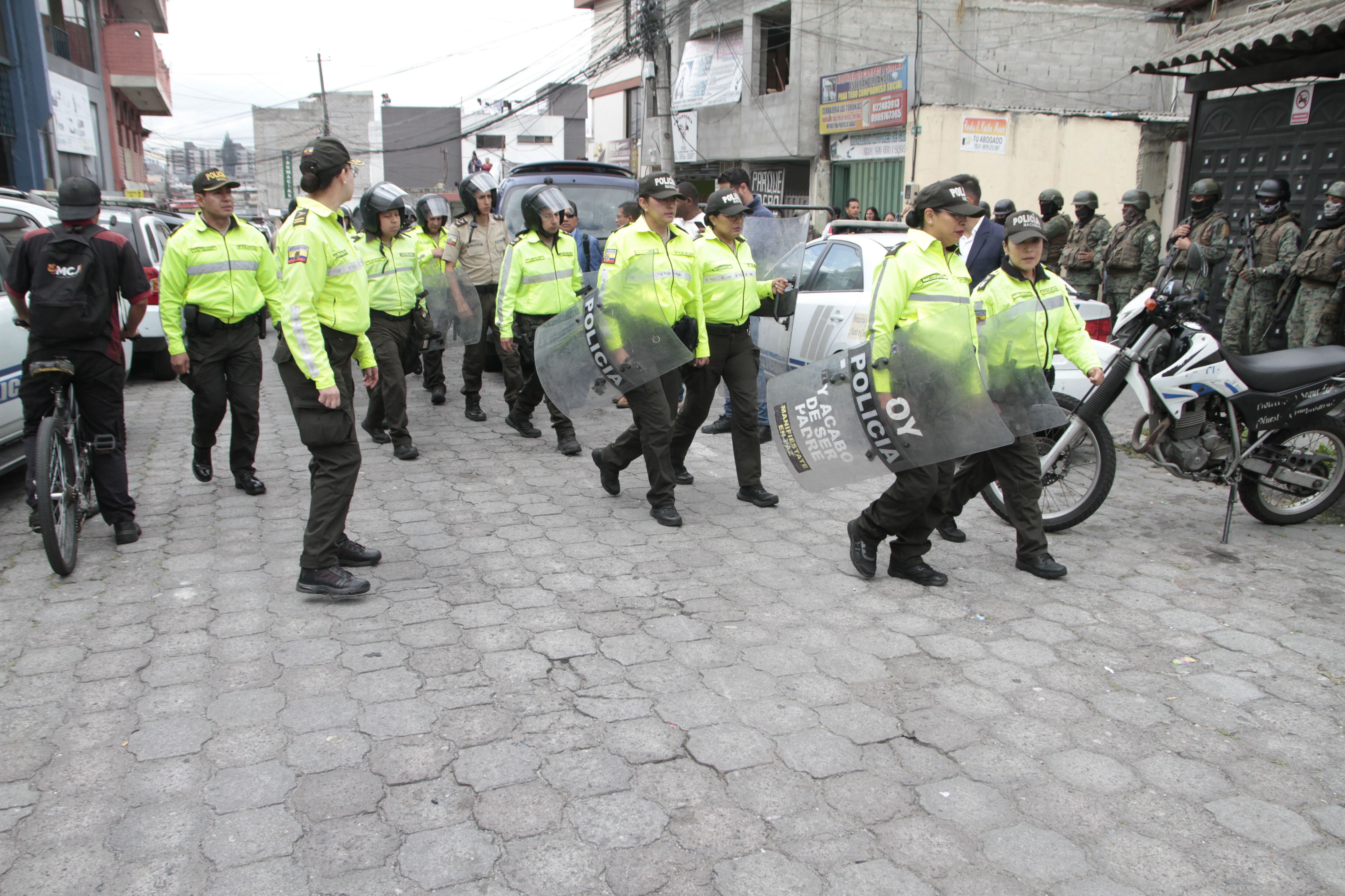 QUITO, Jan. 10, 2024 -- Ecuadorian police patrol in Quito, Ecuador, Jan. 9, 2024. Ecuadorian President Daniel Noboa on Tuesday declared "internal armed conflict" and mobilized the army to combat organized crime linked to drug trafficking, following an escalation in violence in the South American country. Ecuador's government declared a 60-day state of emergency on Monday with a nighttime curfew to quell violence in cities and inside prisons. Tuesday's measure followed a day of riots and disturbances at several prisons, including a prisonbreak that saw 39 inmates escape from a facility in the Andean city of Riobamba and the shocking armed takeover of a television station in Guayaquil in mid-broadcast.,Image: 835636602, License: Rights-managed, Restrictions: , Model Release: no, Credit line: Mateo Armas / Xinhua News / ContactoPhoto